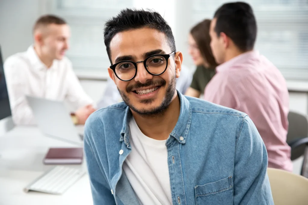 Latina professional greeting her new team on a remote onboarding video call